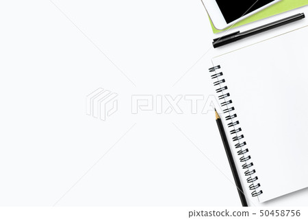 White office desk table with notebook and supplies White office desk table with notebook and supplies 50458756