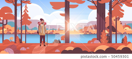 male tourist hiker with backpack man traveler holding stick standing in forest hiking concept male tourist hiker with backpack man traveler holding stick standing in forest hiking concept 50459301