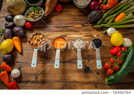 Assortment of fresh vegetables on wooden background Assortment of fresh vegetables on wooden background 50460764