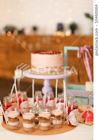 Tasty birthday big cake and yummy drinks on table. Tasty birthday big cake and yummy drinks on table. 50460984