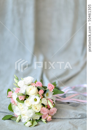 Isolated bouquet of flowers at photo studio in blue background. 50461305