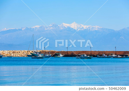 Sea, boats and snow maountains in Peloponnese, Greece 50462009