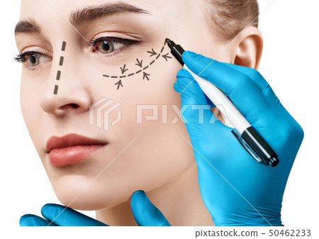 Beautiful woman face with correction lines. 50462233