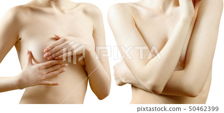 Young woman touching her breast near big pink ribbon. Young woman touching her breast near big pink ribbon. 50462399