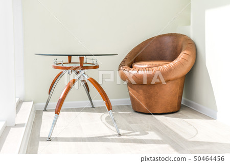 The photo of  balcony with a chair and a table 50464456