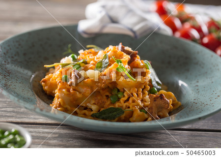 Italian pasta mafalde mushrooms peas and tomato 50465003