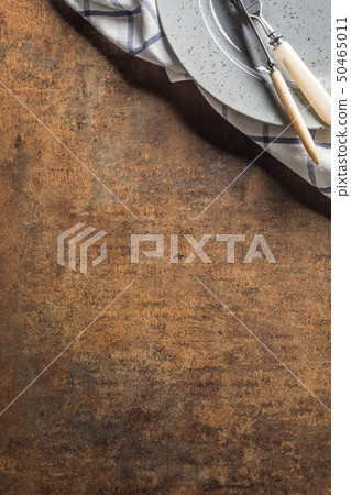 Top of view knife fork plate at napkin on empty 50465011