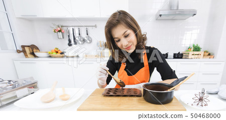 Woman making chocolate Woman making chocolate 50468000
