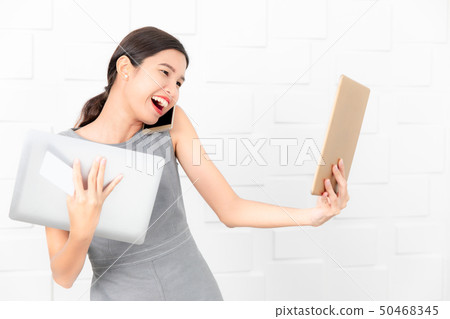 young lady in gray dress 50468345