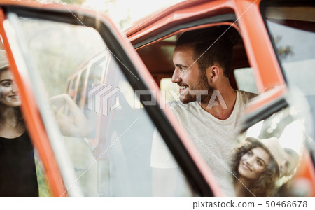 A young couple on a roadtrip through countryside. 50468678