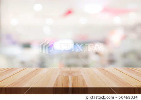 Empty wooden table top with blurred restaurant. Empty wooden table top with blurred restaurant. 50469034
