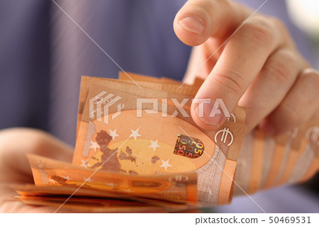 Busy Man Counting Euro Savings Finance Concept Busy Man Counting Euro Savings Finance Concept 50469531