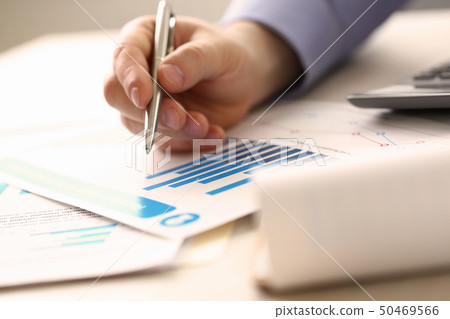 Businessman Controlling Prices Accounting Income Businessman Controlling Prices Accounting Income 50469566