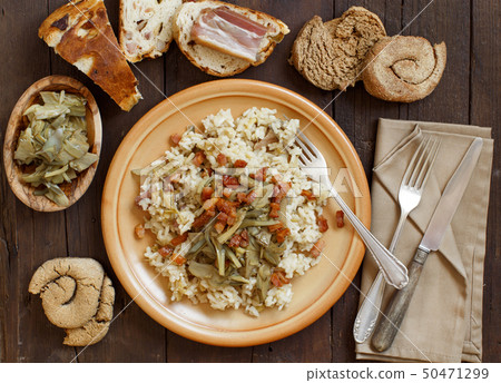Risotto with artichokes and bacon Risotto with artichokes and bacon 50471299