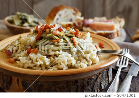 Risotto with artichokes and bacon Risotto with artichokes and bacon 50471301