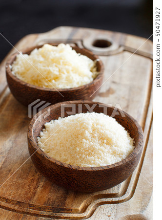 Bowls with grated parmesan cheese 50471927