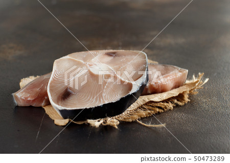 Two shark steak on a dark board 50473289
