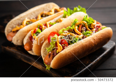 Three delicious hotdogs Three delicious hotdogs 50473372