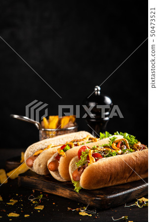 Three delicious hotdogs 50473521