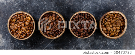 Four different varieties of coffee beans, flat lay, top view 50473783