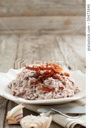 Risotto with red radicchio and crispy bacon 50473846