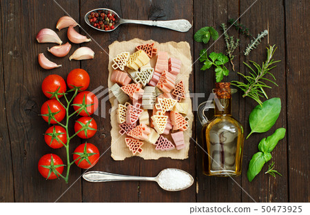 Tricolor pasta, vegetables and herbs Tricolor pasta, vegetables and herbs 50473925
