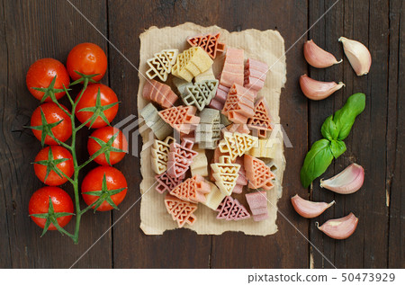 Tricolor fir tree shaped pasta, vegetables and 50473929
