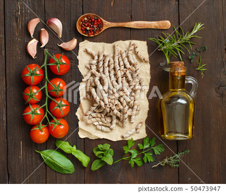 Whole wheat pasta, vegetables, herbs and olive oil 50473947