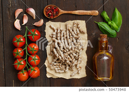Whole wheat pasta, vegetables, herbs and olive oil 50473948