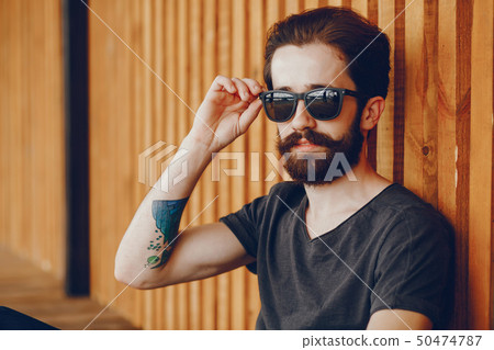 A beautiful guy with a tattoo A beautiful guy with a tattoo 50474787