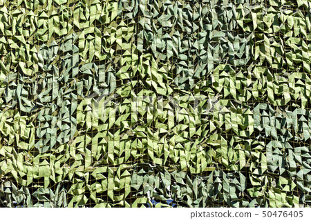Military camouflage net as background 50476405
