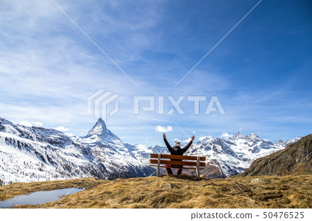 Man on a bench with Matterhorn view 50476525