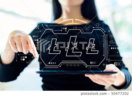 Litecoin with woman using tablet 50477202