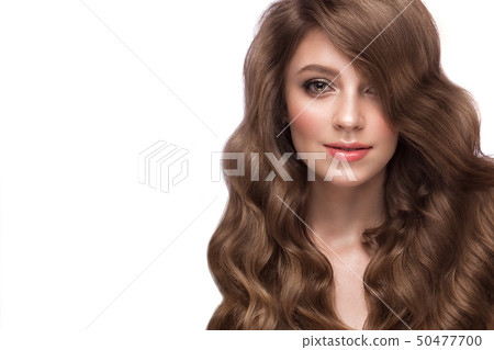 Beautiful brown-haired girl with a perfectly curls hair, and classic make-up. Beauty face and hair. Beautiful brown-haired girl with a perfectly curls hair, and classic make-up. Beauty face and hair. 50477700