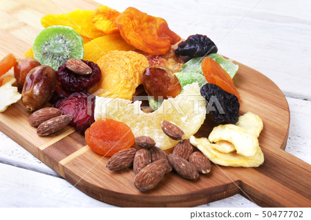Organic Healthy Assorted Dried Fruit on bamboo wine board. Selective focus. 50477702