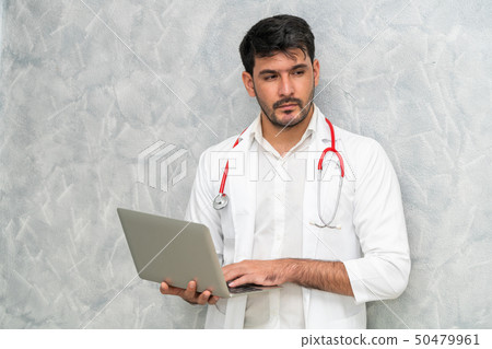 Doctor using laptop computer at the hospital. Doctor using laptop computer at the hospital. 50479961