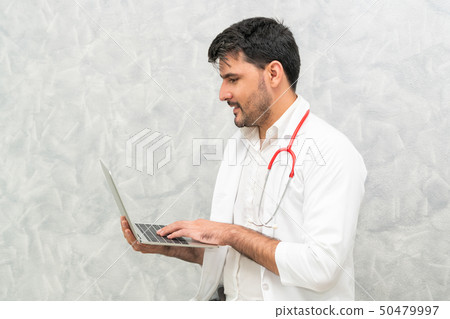 Doctor using laptop computer at the hospital. Doctor using laptop computer at the hospital. 50479997