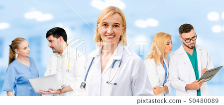 Doctor working in hospital with other doctors. 50480089