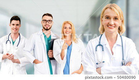 Doctor working in hospital with other doctors. 50480090