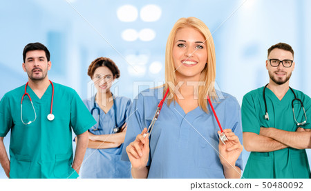 Doctor working in hospital with other doctors. Doctor working in hospital with other doctors. 50480092
