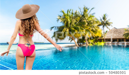 Happy young woman at beach in summer vacation. Happy young woman at beach in summer vacation. 50480301