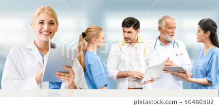 Doctor working in hospital with other doctors. Doctor working in hospital with other doctors. 50480302
