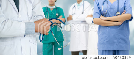 Doctor working in hospital with other doctors. 50480399