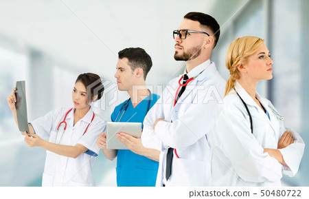 Doctor working in hospital with other doctors. Doctor working in hospital with other doctors. 50480722