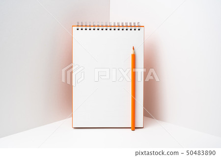 orange spiral notebook with white page on 3D space 50483890