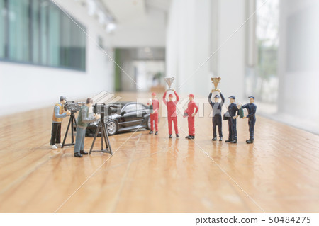 driver mini figure with cup at the background driver mini figure with cup at the background 50484275