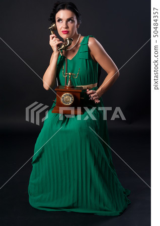 Pretty woman with retro phone 50484357