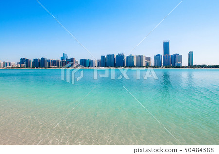 Blue sea at marina island with modern Abu Dhabi 50484388