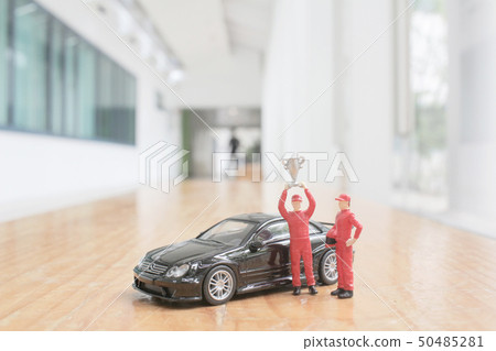 driver mini figure with cup at the background driver mini figure with cup at the background 50485281