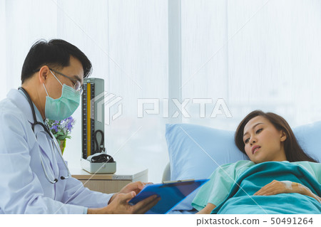 Asian doctor check the sickness of female patient. Asian doctor check the sickness of female patient. 50491264